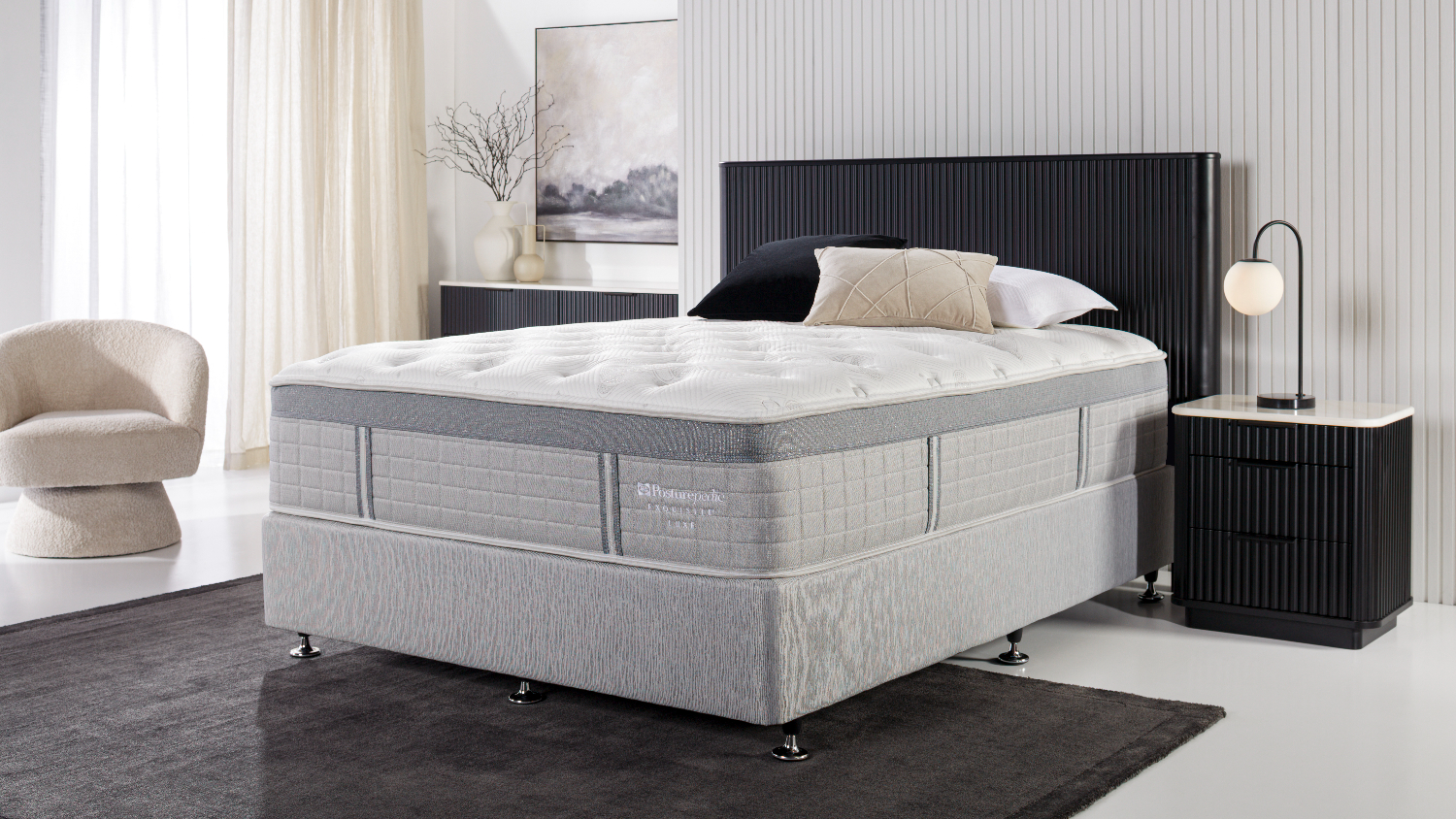 A view of the Exquisite Boutique Firm Extra Long Double Mattress displayed in a brightly-lit modern bedroom