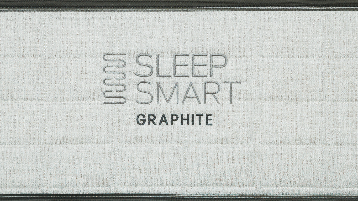 Embroidered logo on the side of the Graphite Medium Single Mattress featuring the Sleep Smart brand name