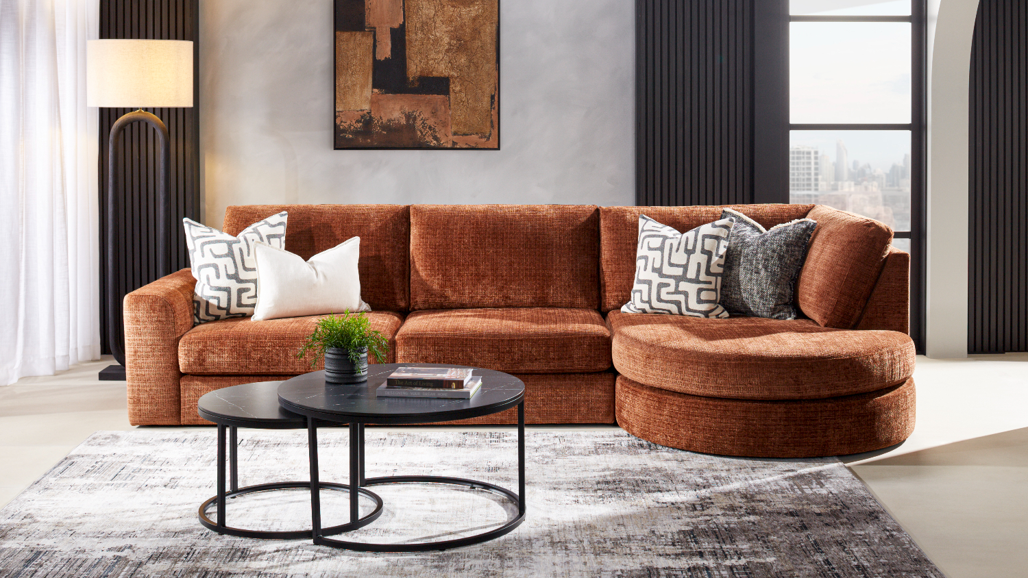 Kyle 3-seater fabric corner sofa in warm rust tone with a right-facing round chaise, styled in a modern living room