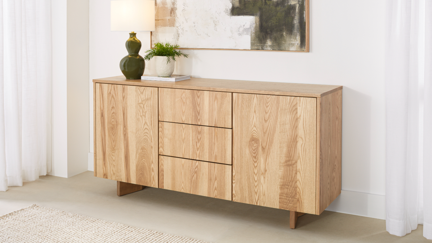 Sinclair 1600mm buffet table in light natural wood. Features two side doors and four central drawers