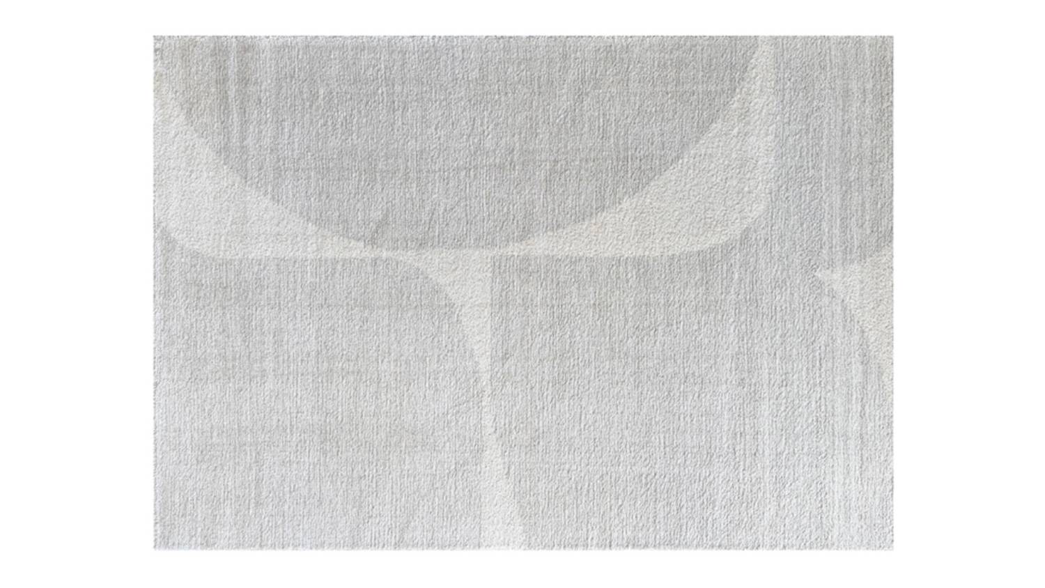 Full view of grey rug surface with smooth, even weave and subtle tonal variation