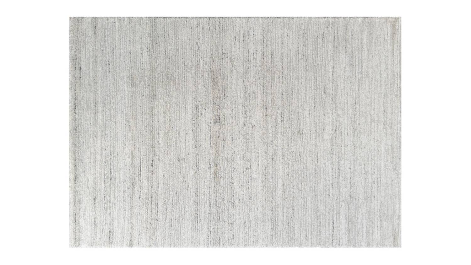 Full view of beige rug surface showing soft, even texture with subtle woven detail