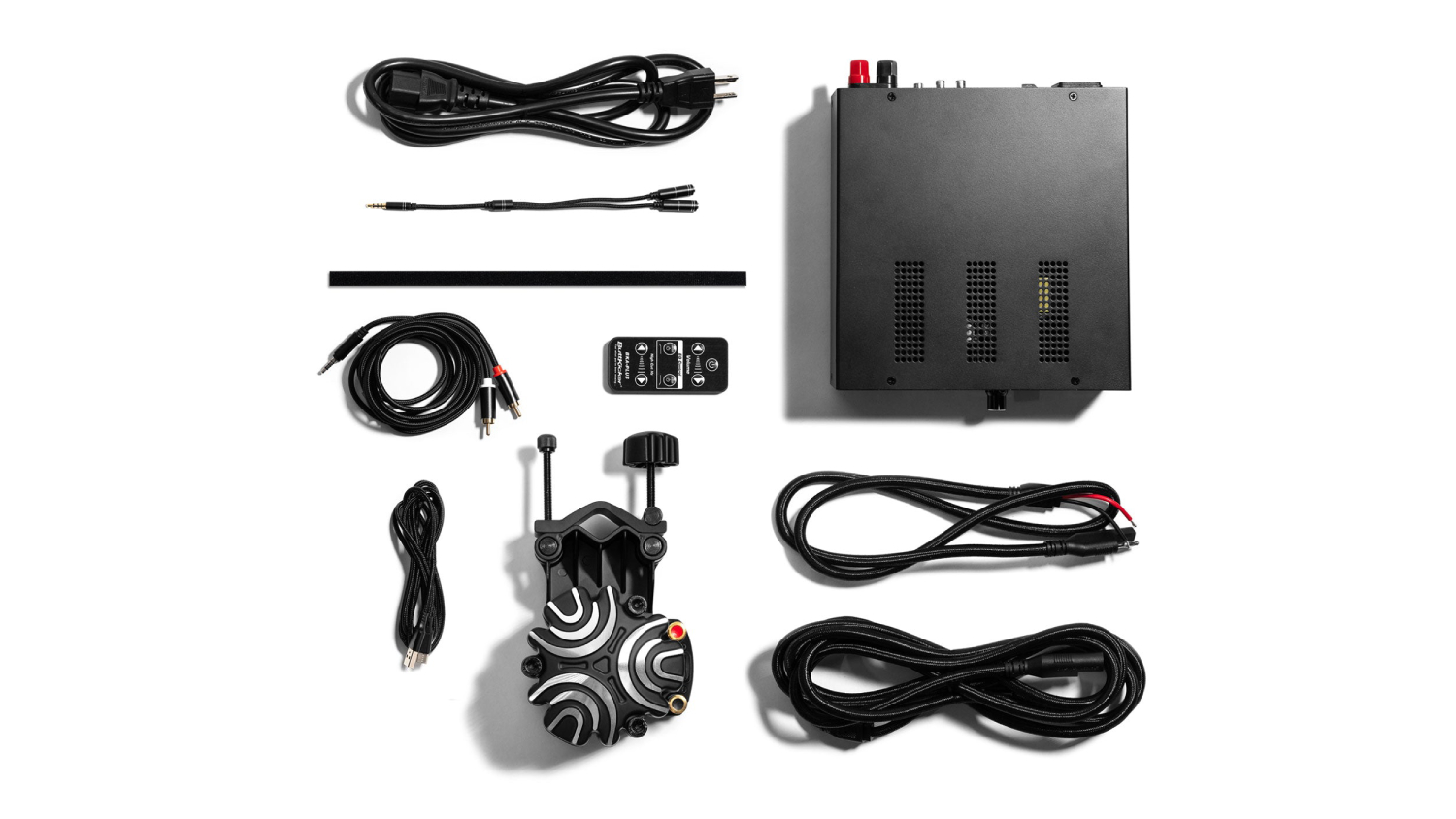 Complete haptic feedback system kit with transducer, amplifier, cables, and mounting accessories