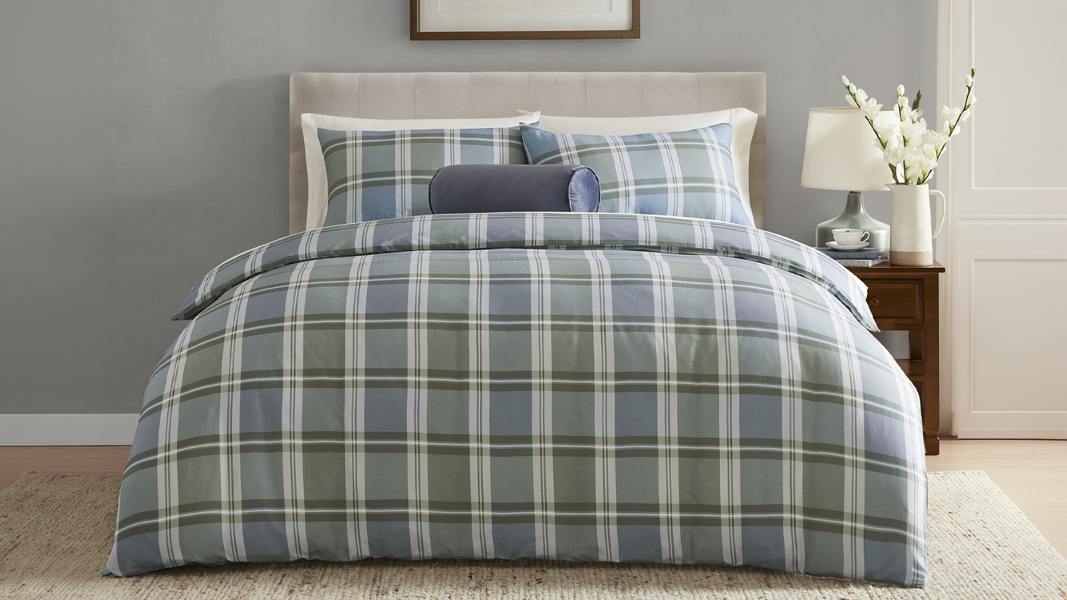 Laura Ashley Maitland Blue Duvet Cover Set displayed on a neatly styled bed, featuring a classic check pattern