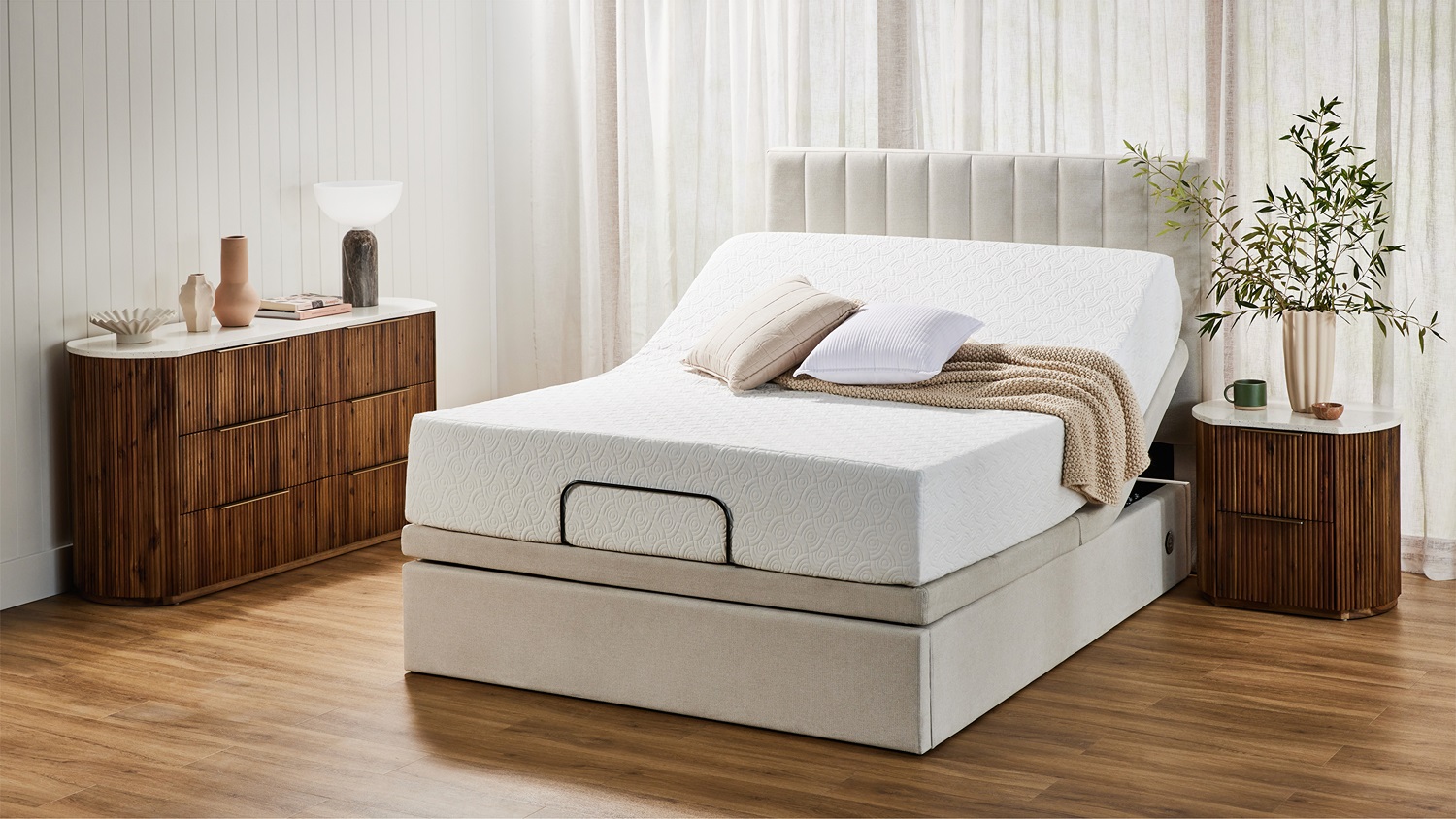 Super King Adjustable Base by Mlily shown in a modern bedroom with the head section elevated