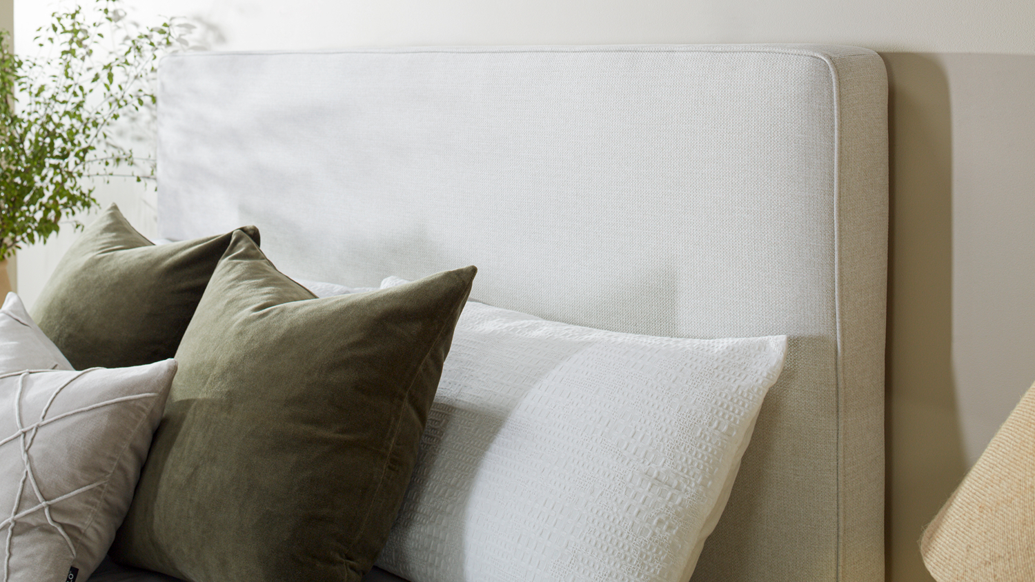 Close-up view of the Majestic Home Oslo Queen Upholstered Headboard by Mlily in a modern bedroom