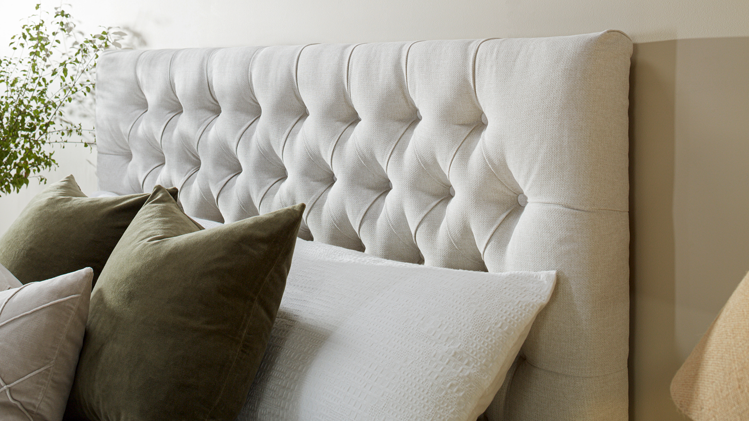 Close-up view of the Majestic Home Vienna Queen Upholstered Headboard by Mlily in a modern bedroom