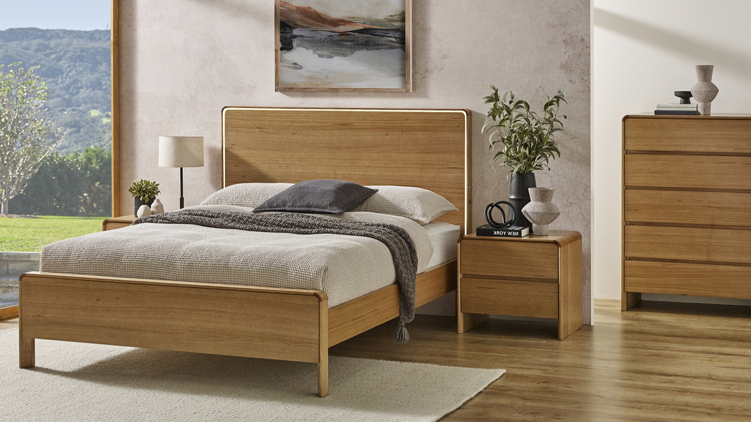 Cassie Bed Frame featuring a lighted wooden headboard in a bright, styled modern bedroom