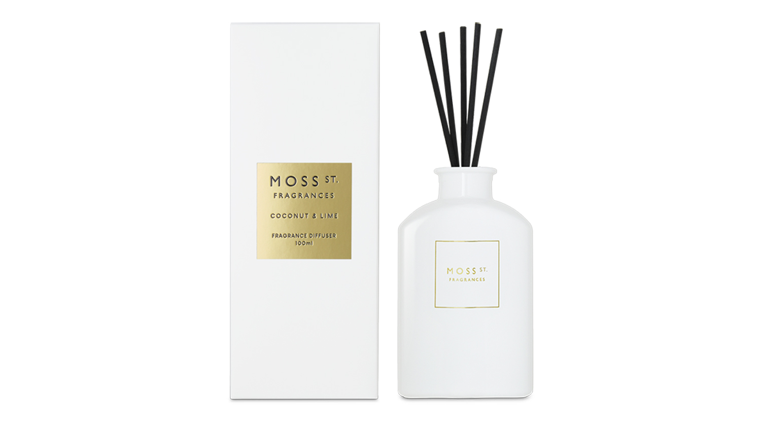 Moss St. Coconut & Lime 100ml mini reed diffuser bottle with black reeds standing next to its white packaging box
