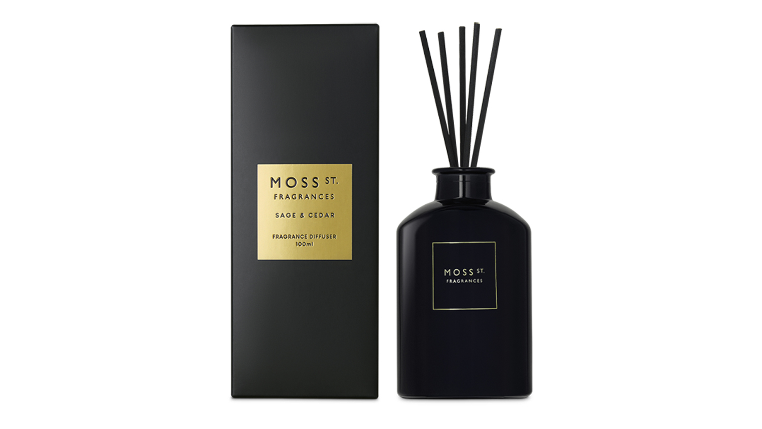 Moss St. Sage & Cedar 100ml reed diffuser in a sleek black bottle placed next to its matching black box with gold label