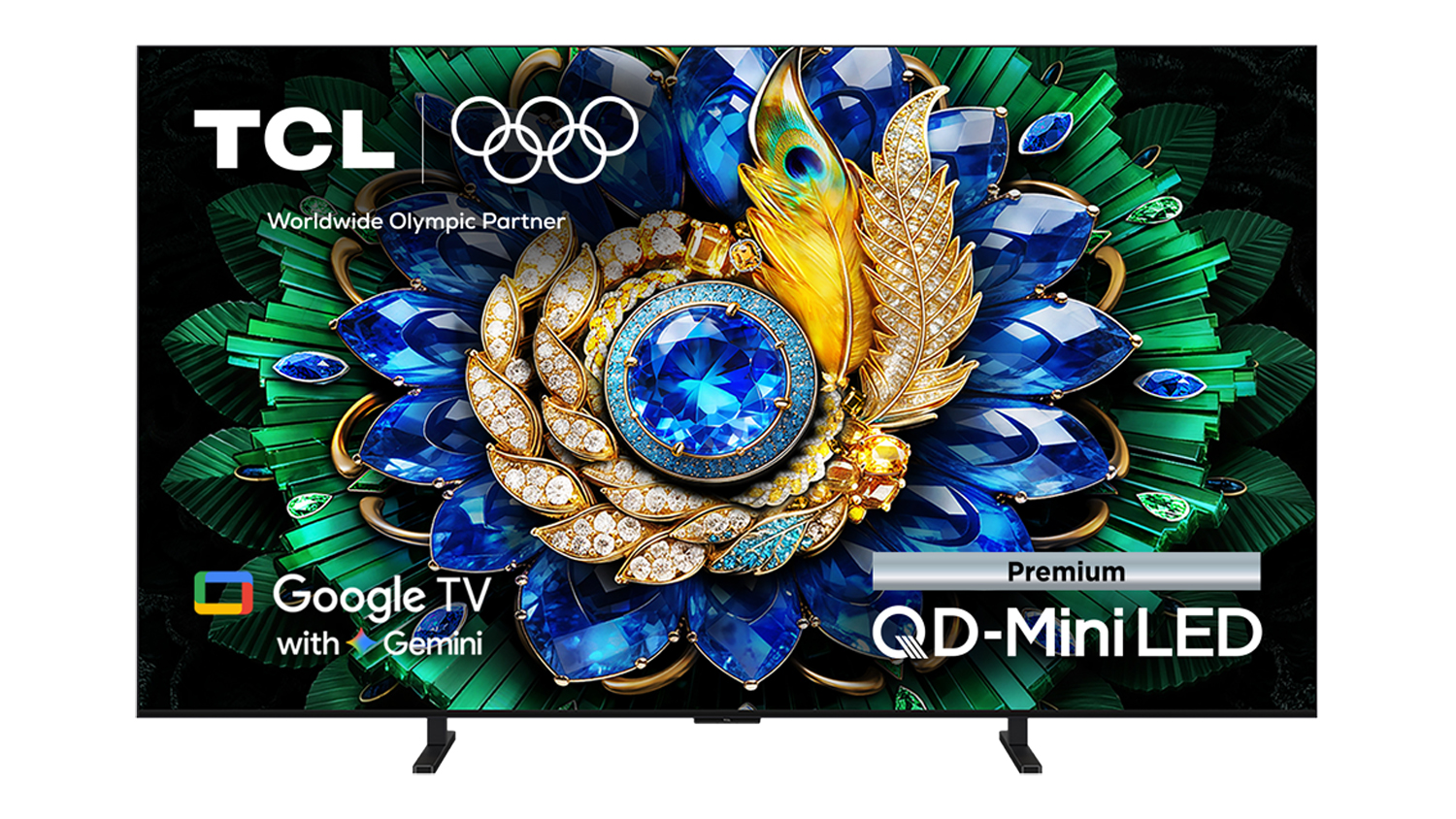 Front view of the TCL 65‑inch C6L TV on dual feet, displaying a detailed blue and green jewelled floral image