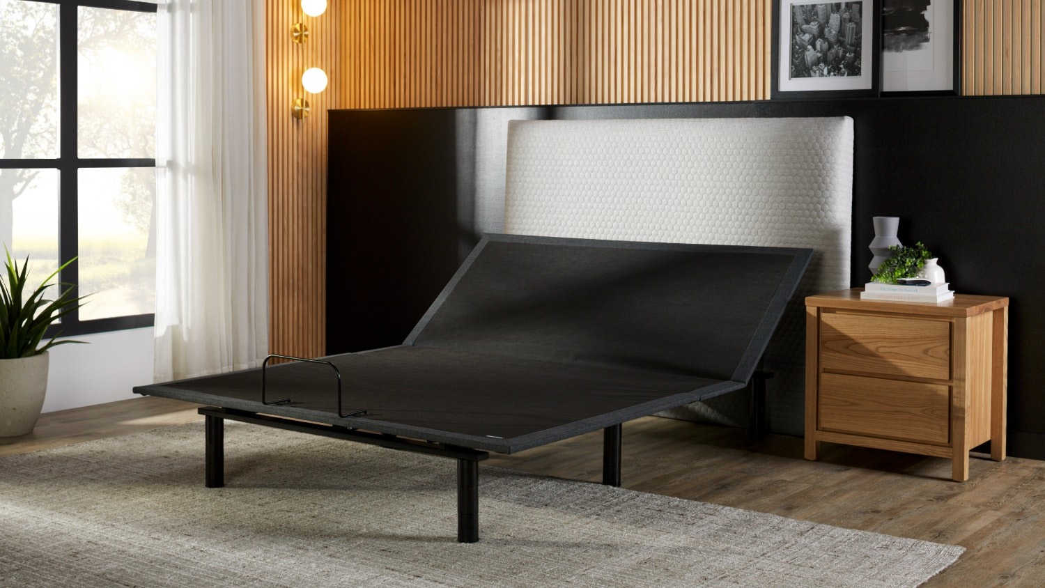 Motion Extra Long Single Adjustable Base by Tempur shown with the head section elevated