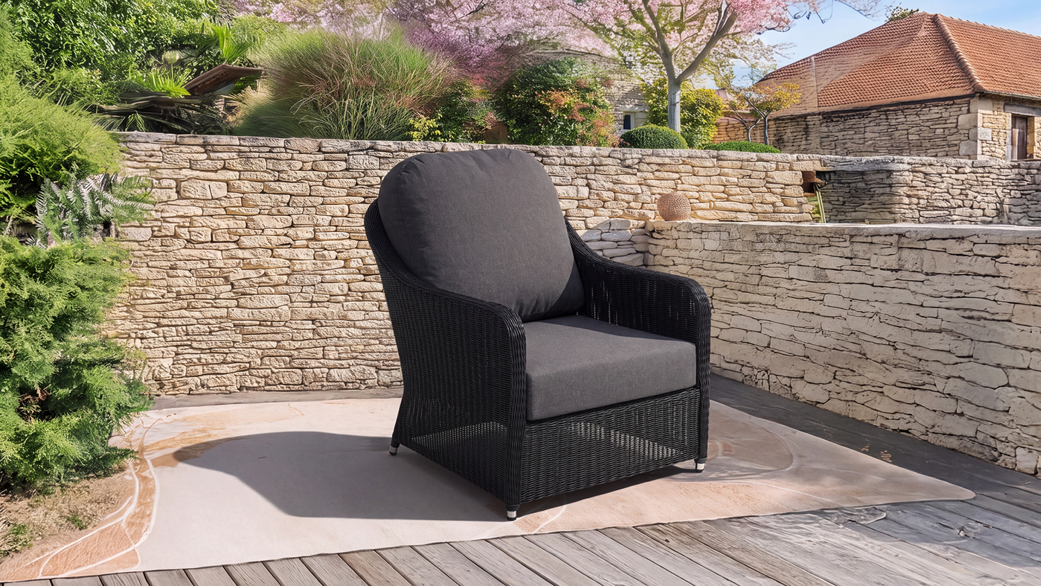 Marbella Outdoor Armchair featuring a woven wicker-style frame positioned on a patio deck