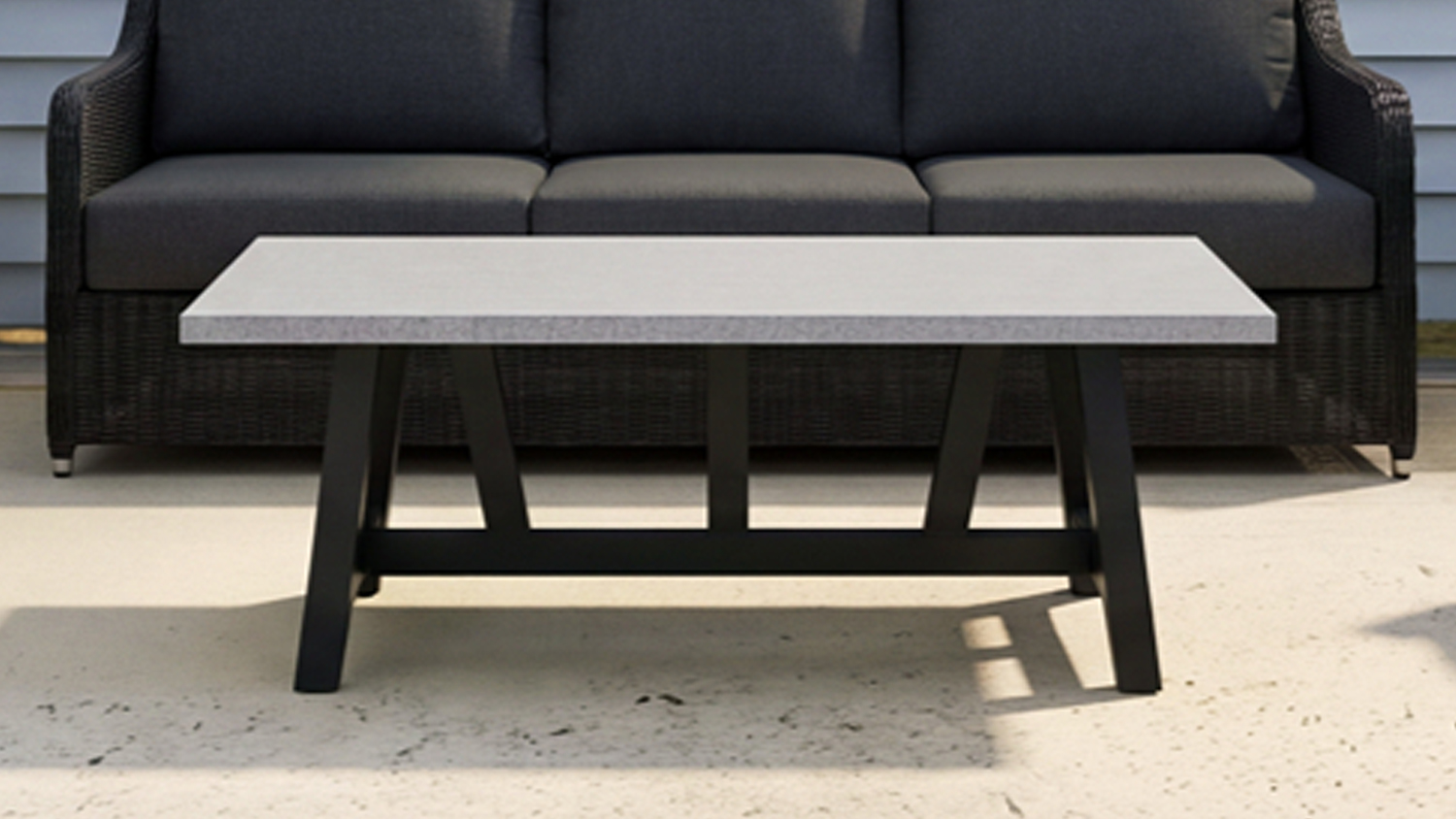 Marbella 1200mm Outdoor Coffee Table featuring a rectangular light-coloured tabletop and black angled legs