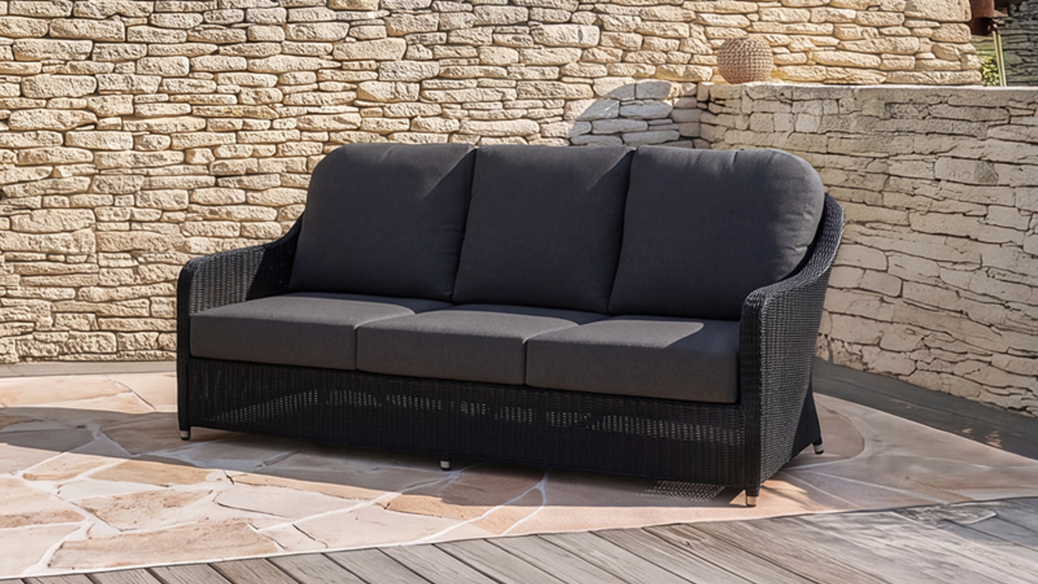 Marbella 3 Seater Outdoor Sofa featuring a woven wicker-style frame with three dark grey seat and back cushions