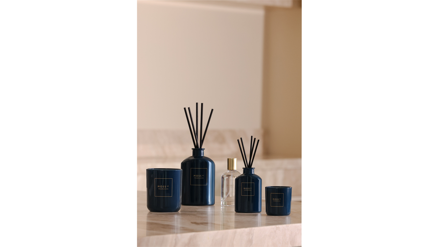 A view of the Moss St. room fragrance, scented candle, and reed diffuser products
