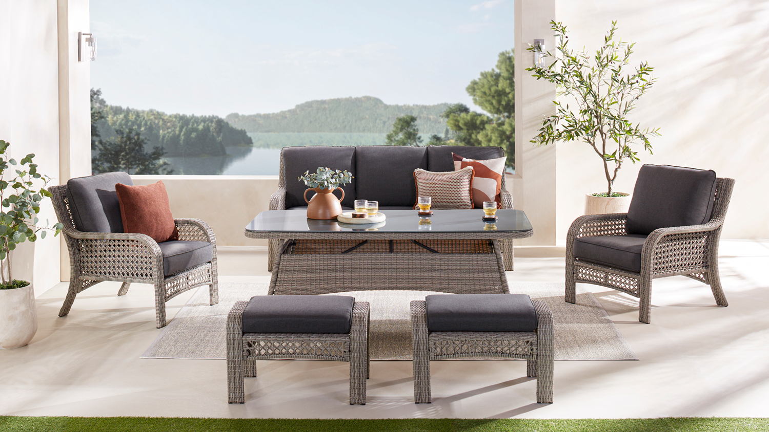 Rosa 6 Piece Outdoor Low Dining Suite set in a bright outdoor patio with a scenic lakeside backdrop