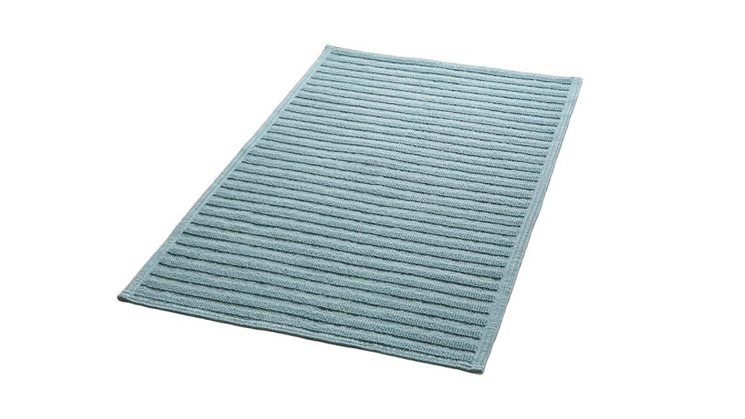 Baltic Green ribbed Baksana Nova Luxury Bath Mat beside a modern freestanding bathtub
