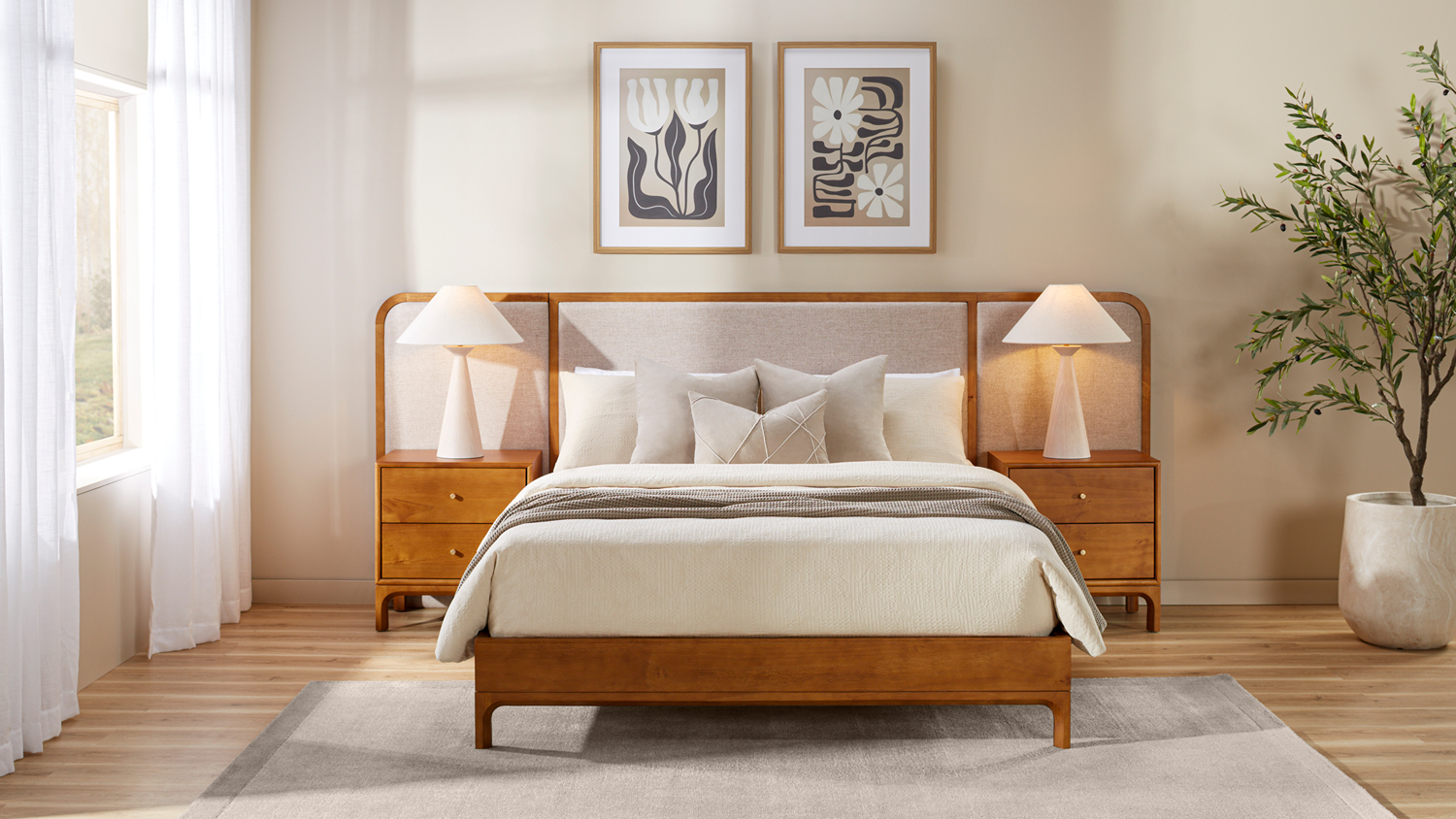 Front view of wooden bed frame with beige extended upholstered panel headboard and matching bedside tables