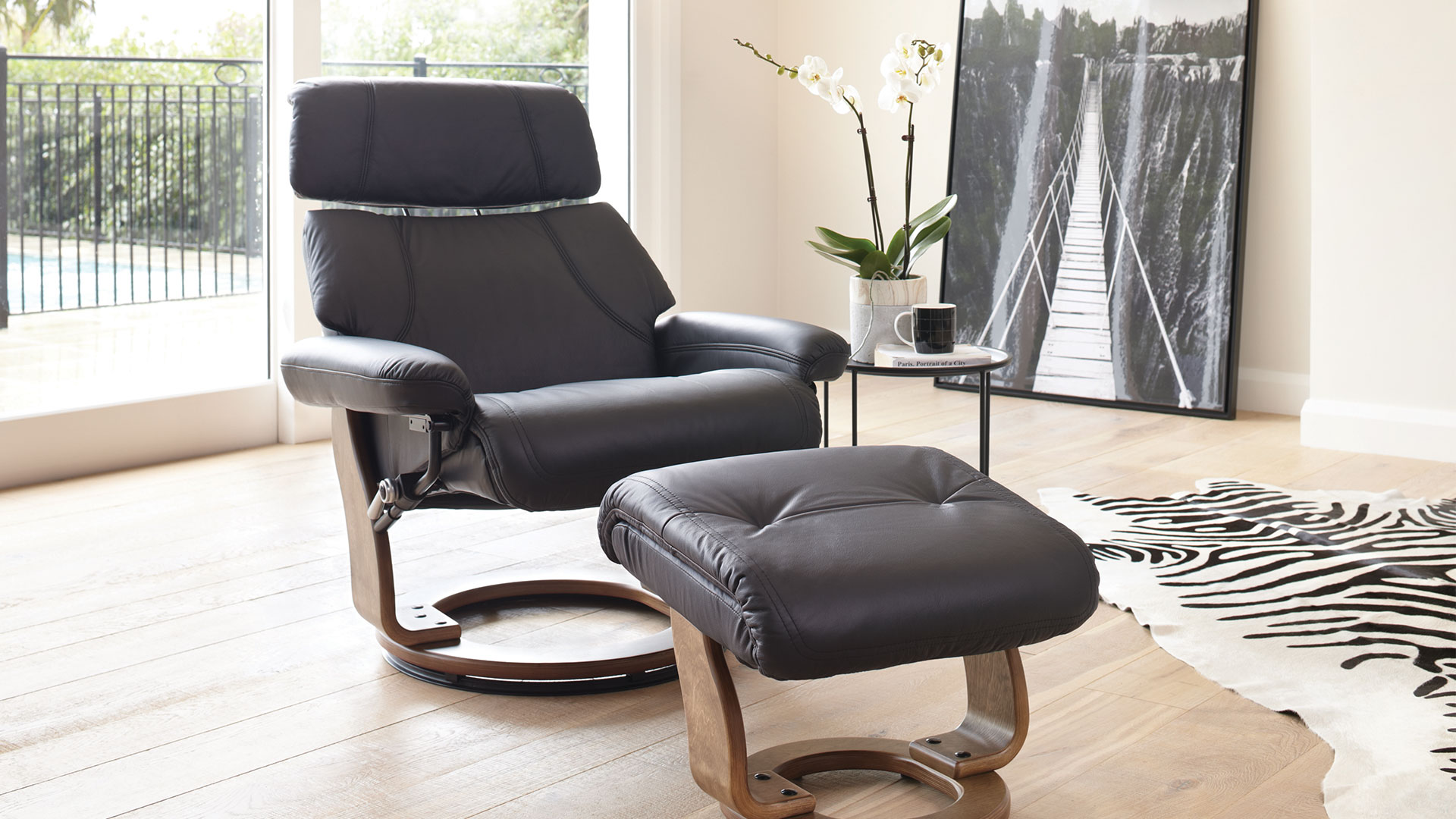 Gostenbury Leather Recliner Chair and Foot Stool by Debonaire Furniture