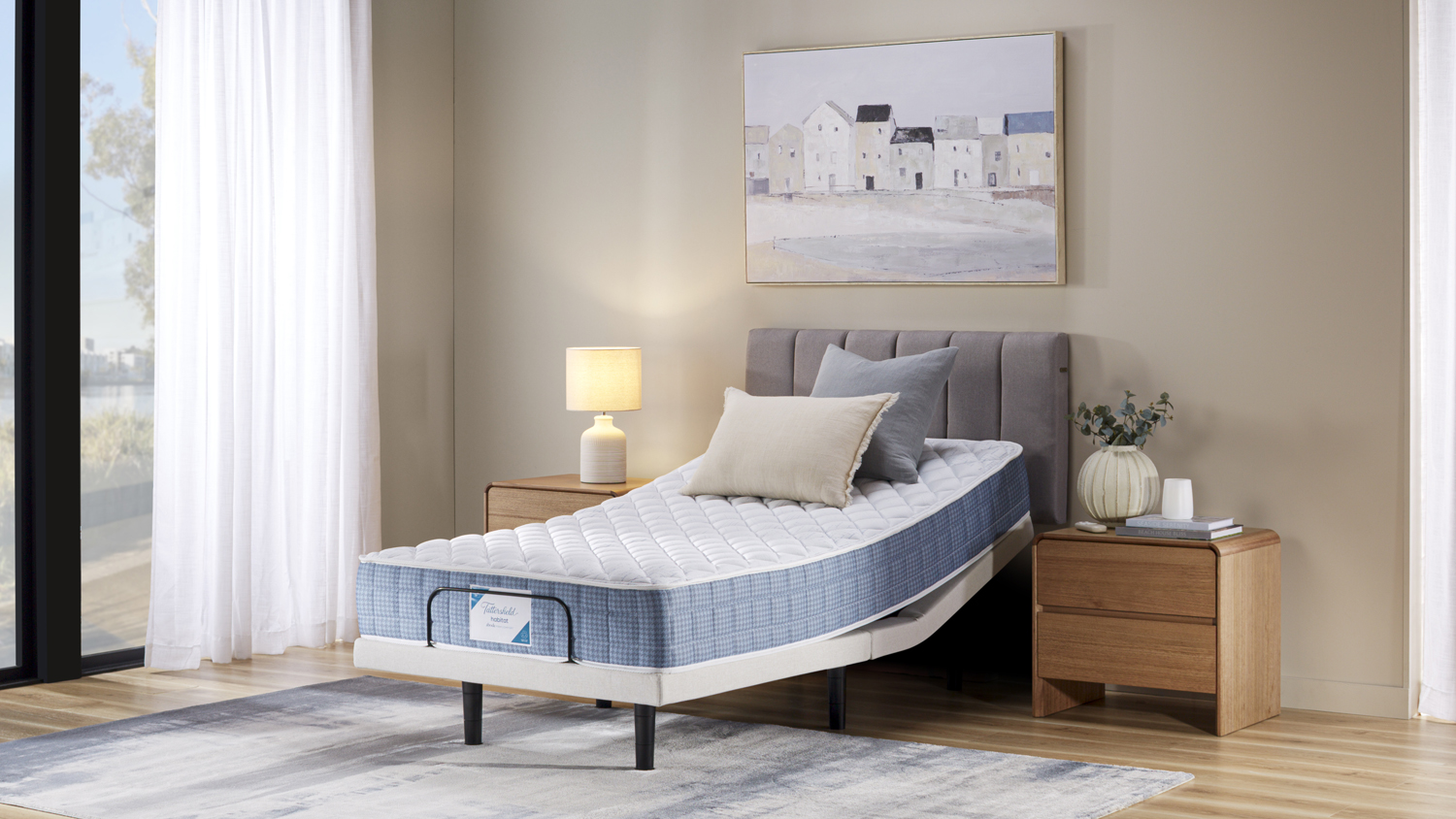 Tattersfield Abode mattress on Majestic Motion adjustable base raised at head in a modern bedroom setting