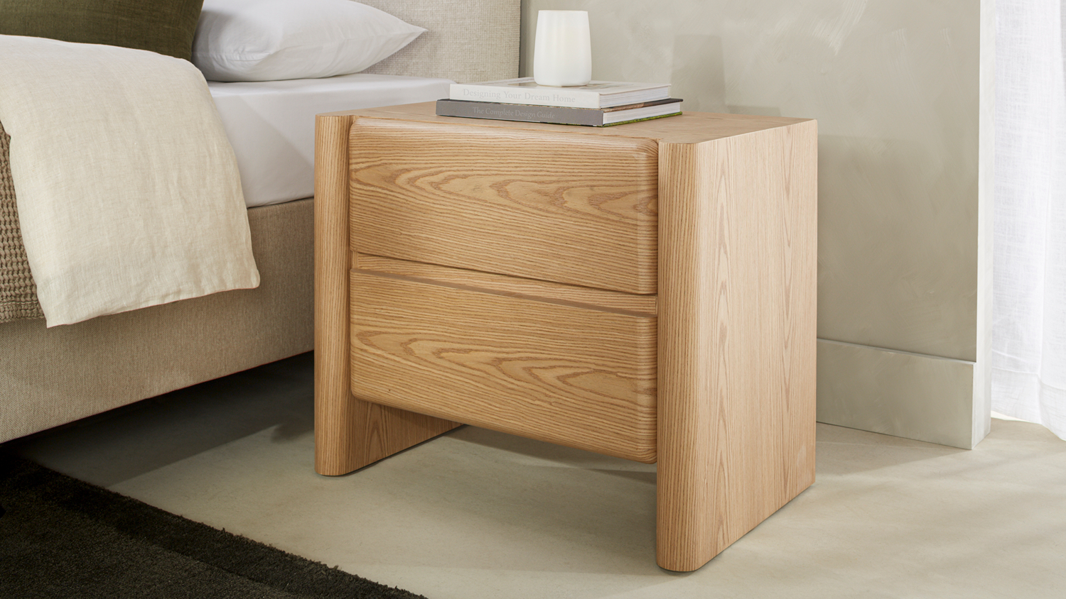 Gia 2 Drawer Bedside Table in a white oak finish, featuring a curved-frame design with rounded edges