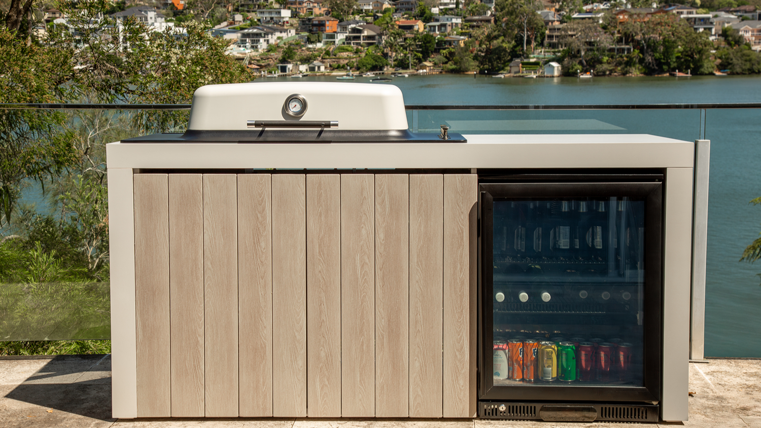 Everdure Furnace 3-Burner Gas BBQ Outdoor Kitchen unit with glass-door fridge on a balcony terrace