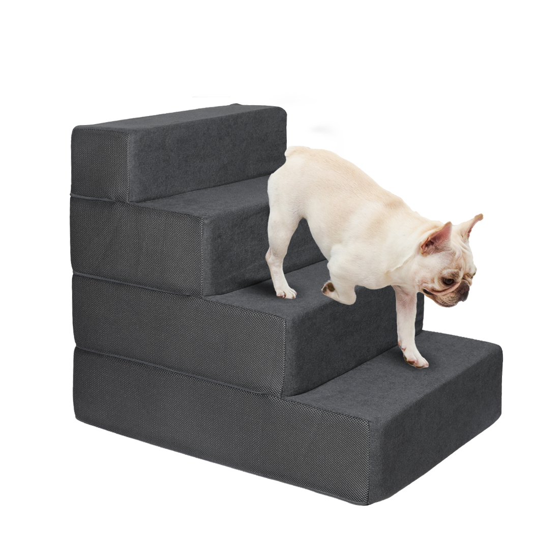 Angled view of grey foam four-step pet stairs with a textured fabric cover, featuring a small cream dog walking down the steps