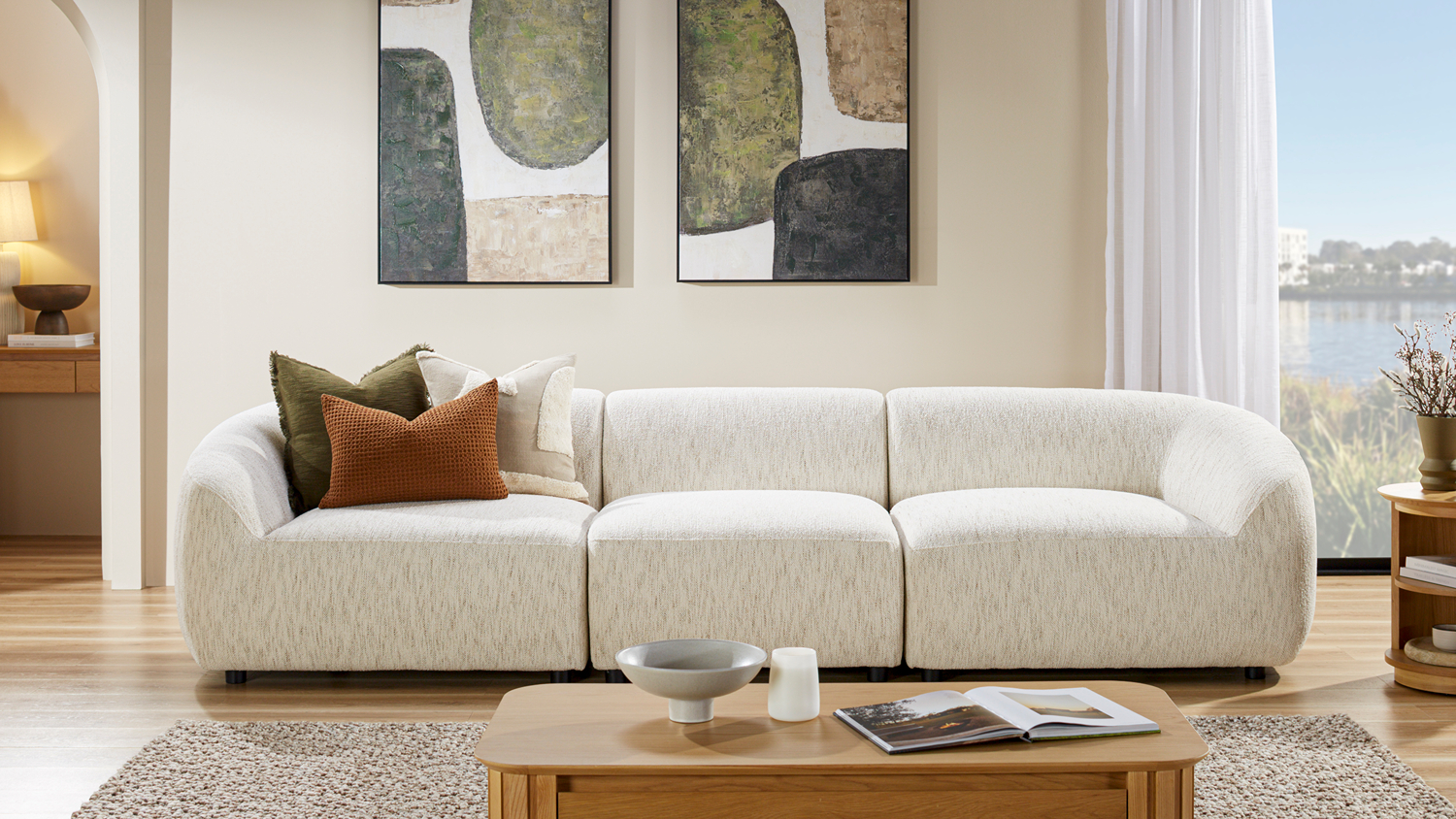 Villa 3-Seater Fabric Modular Sofa with decorative pillows in a modern living room