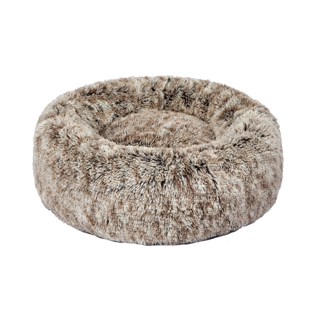 Front angle view of a natural-tone PaWz Calming Fluffy Pet Bed with a raised bolster rim and round cushioned sleeping area