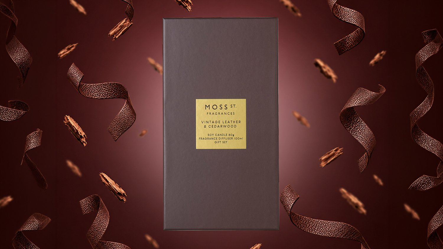 Moss St. Vintage Leather & Cedarwood gift box with gold label on a burgundy background