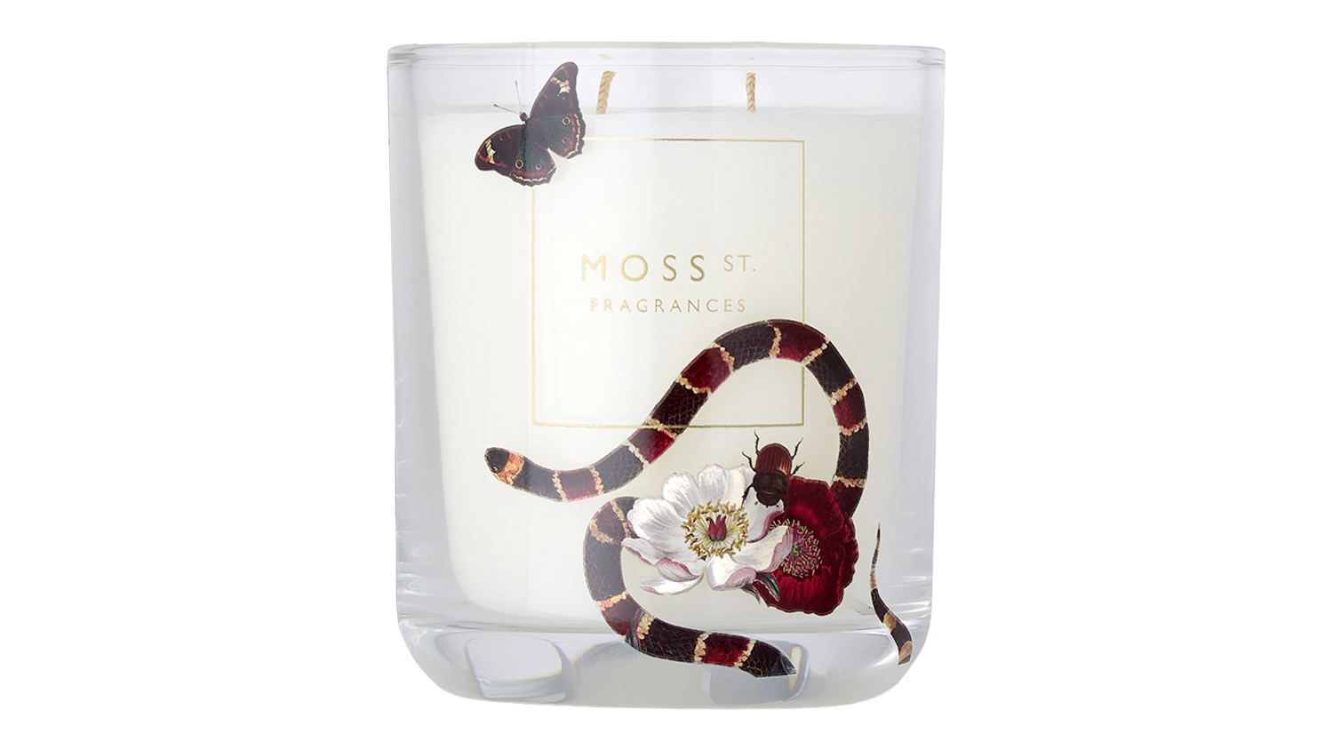 Black Cherry Noir soy candle in a clear glass jar with a gold logo, red-banded snake, white flower and butterfly