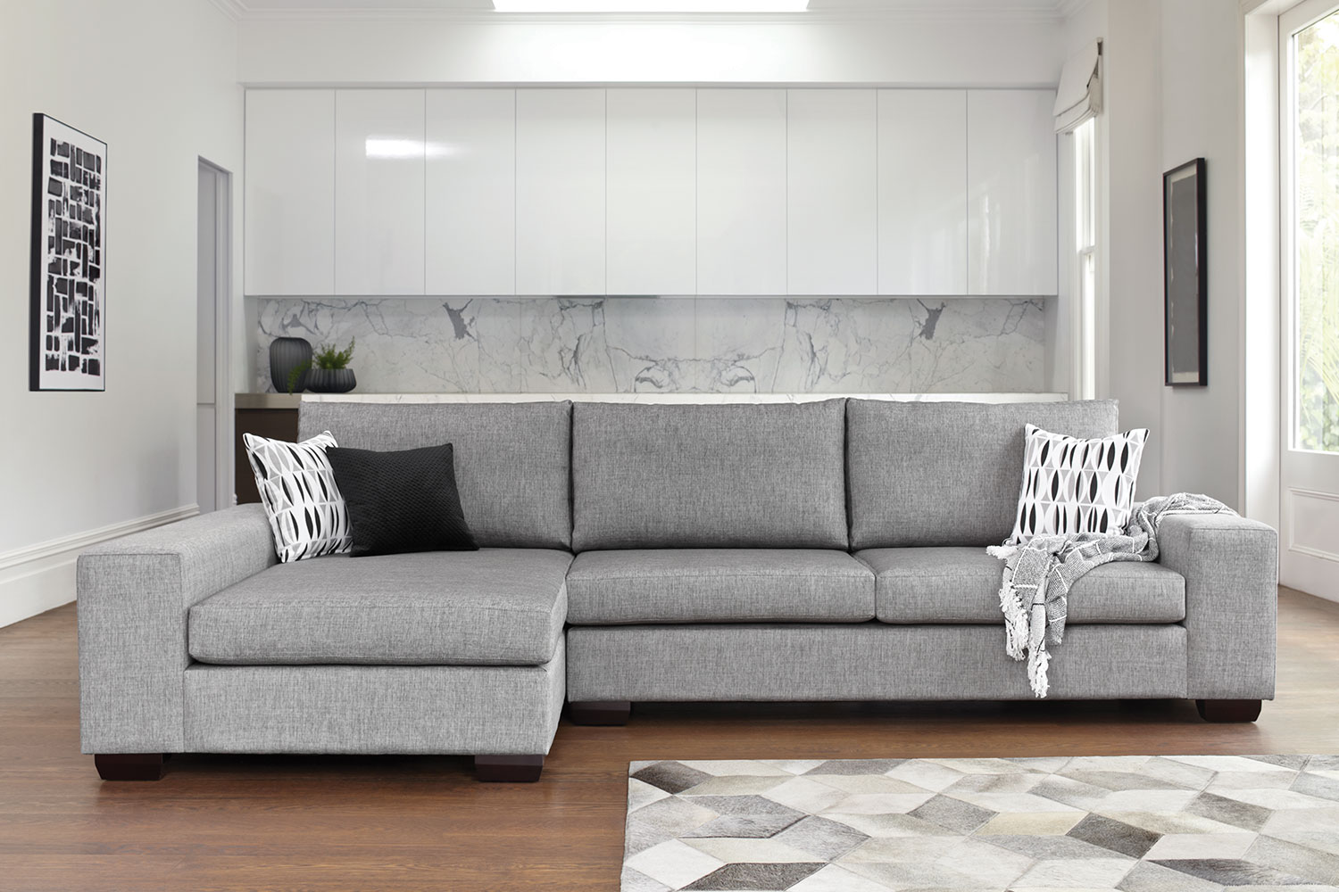 Kingdom 4 Seater Fabric Sofa with Chaise by Furniture Haven Harvey